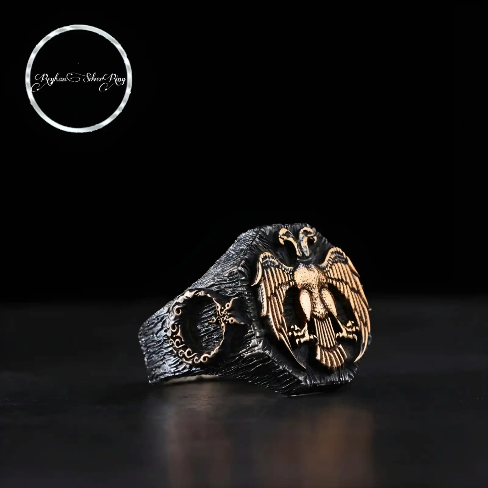 

Мужское серебряное кольцо с двумя головками и орлом