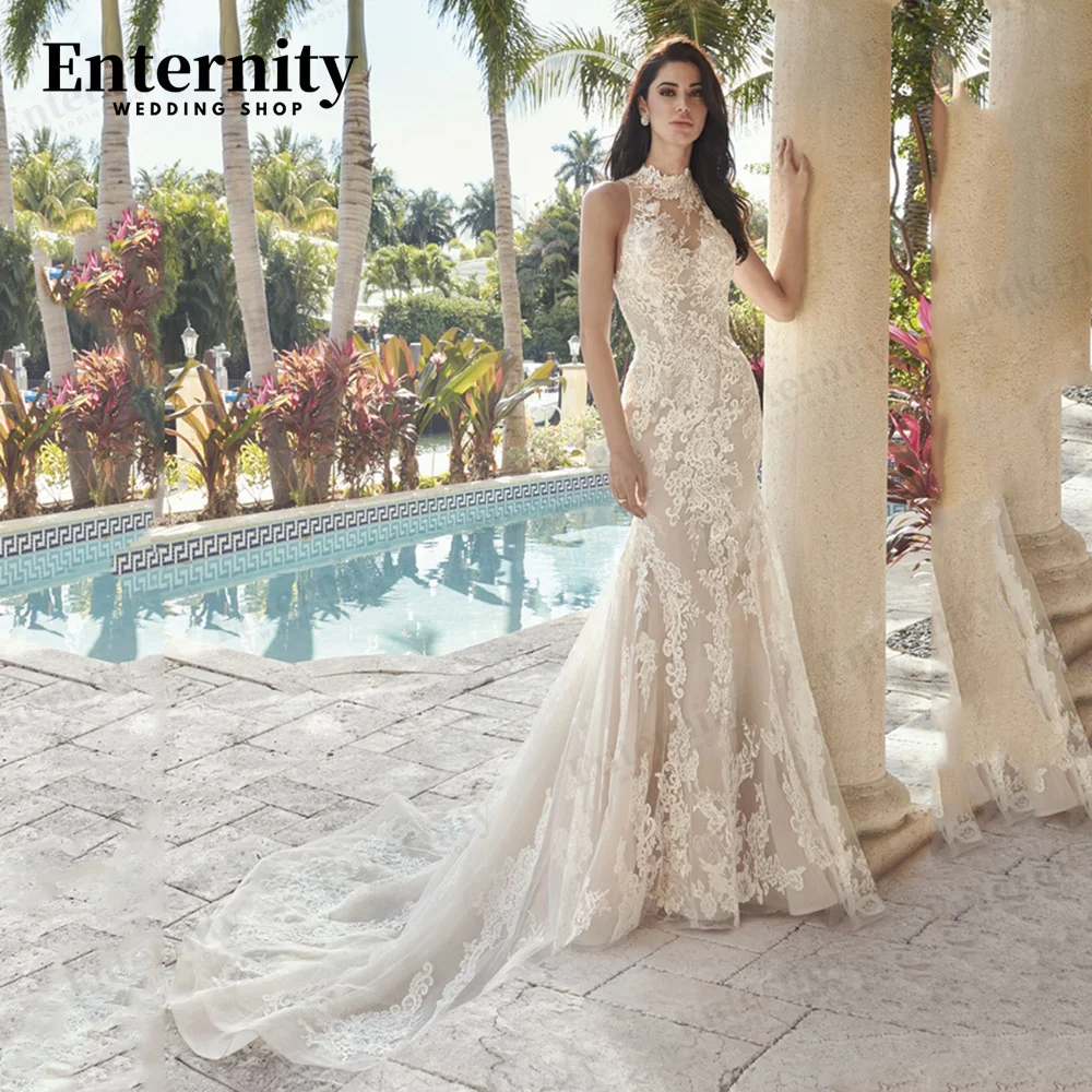 Экстравагантное кружевное свадебное платье-русалка без рукавов с иллюзионной спинкой и пуговицами со шлейфом сердечком платье для невесты
Экстравагантное кружевное свадебное платье-русалка без рукавов с иллюзионной спинкой и пуговицами со шлейфом сердечком платье для невесты