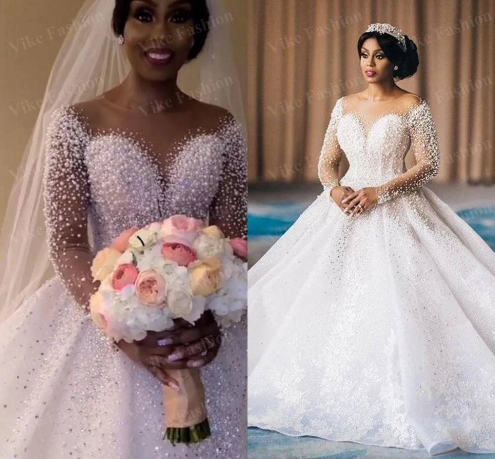 Plus Size Saudi Arabic Sparkly Luxurious Wedding Dresses Pearls Crystals Lace Bridal Gowns Sheer Neck Long Sleeves Wedding Gown
Plus Size Saudi Arabic Sparkly Luxurious Wedding Dresses Pearls Crystals Lace Bridal Gowns Sheer Neck Long Sleeves Wedding Gown