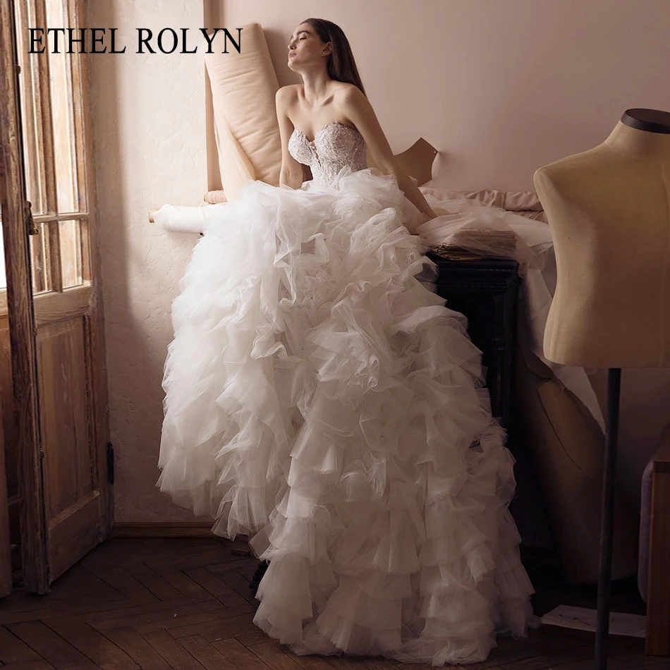 ETHEL ROLYN A-Line Wedding Dress 2022 Charming Strapless Beaded Sequined Ruffles Bride Backless Lace Up Sleeveless Bridal Gown
ETHEL ROLYN A-Line Wedding Dress 2022 Charming Strapless Beaded Sequined Ruffles Bride Backless Lace Up Sleeveless Bridal Gown
