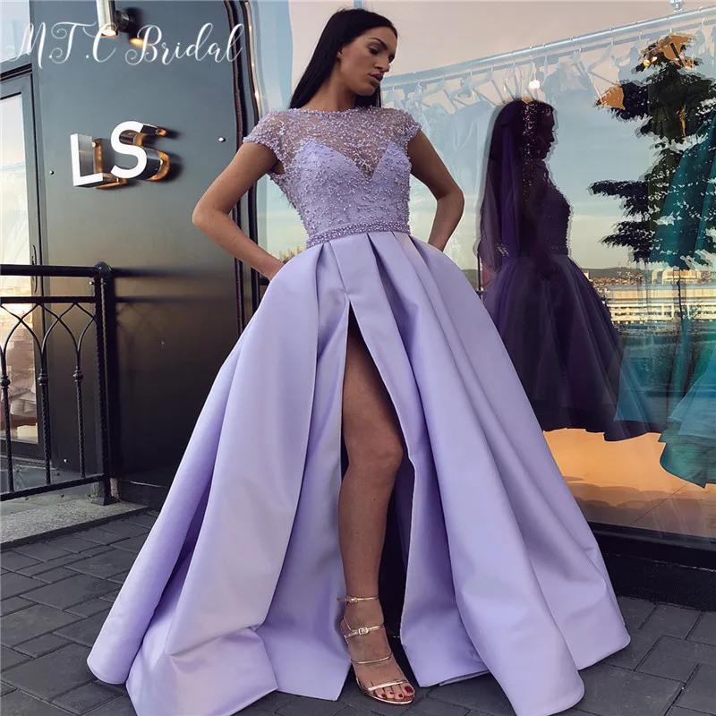 Exquisite Lavender Arabic Prom Dresses Sheer Beads Short Sleeve High Slit Satin Formal Evening Gowns Custom Made 2019 New
Exquisite Lavender Arabic Prom Dresses Sheer Beads Short Sleeve High Slit Satin Formal Evening Gowns Custom Made 2019 New