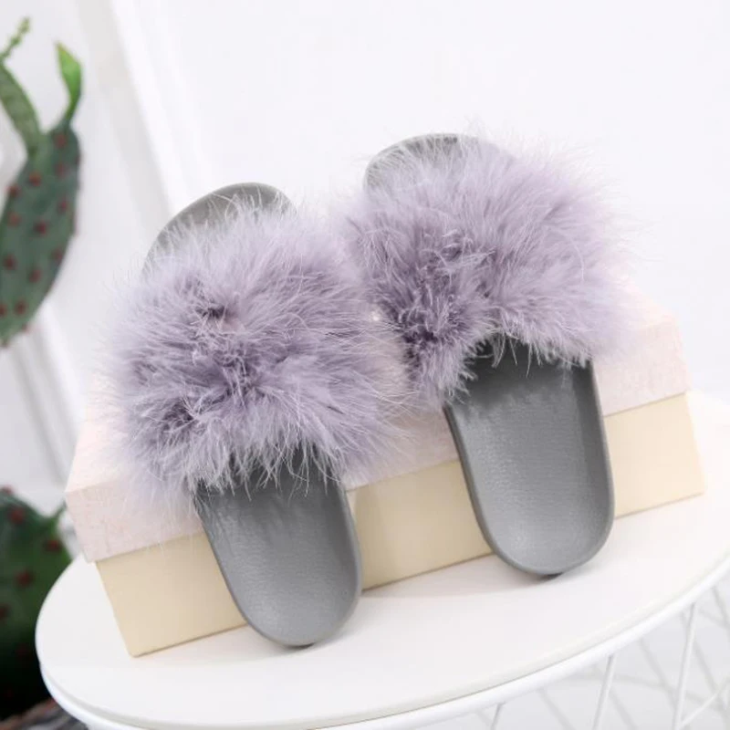 New style feather slippers in Europe and America in 2020 winter wear flat bottom cool slippers for women
New style feather slippers in Europe and America in 2020 winter wear flat bottom cool slippers for women