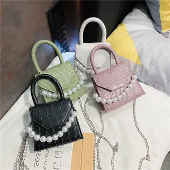 2020 new Korean style messenger shoulder bag simple chain bag messenger bag small square bag pearl portable female bag 
2020 new Korean style messenger shoulder bag simple chain bag messenger bag small square bag pearl portable female bag