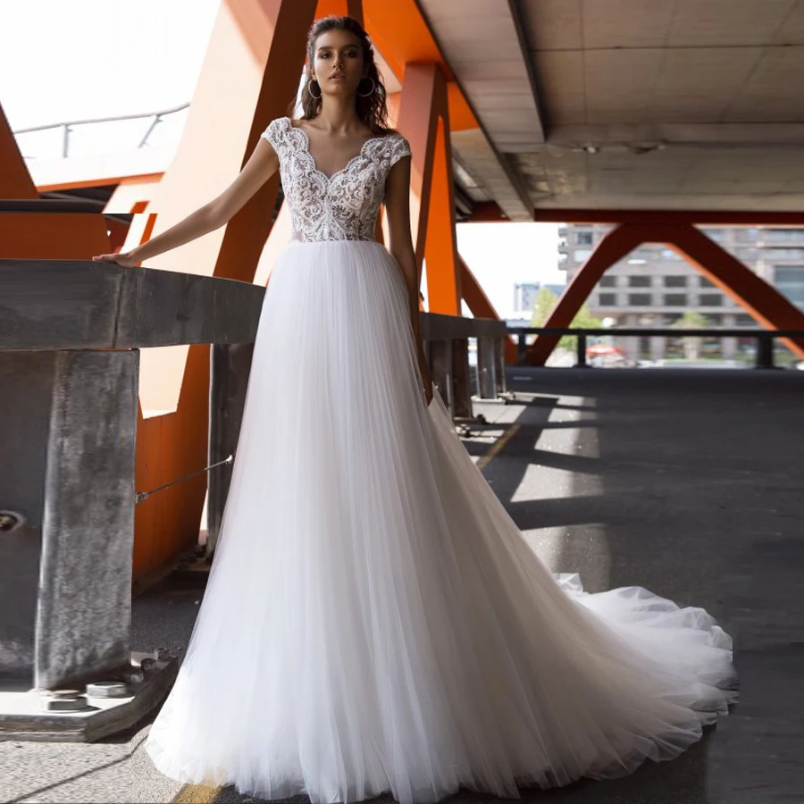 New Cap Sleeve V Neck Wedding Dress Bridal Gowns Delicate Lace Applique Flowy Tulle A-line Bride Dress Robe De Mariee
New Cap Sleeve V Neck Wedding Dress Bridal Gowns Delicate Lace Applique Flowy Tulle A-line Bride Dress Robe De Mariee