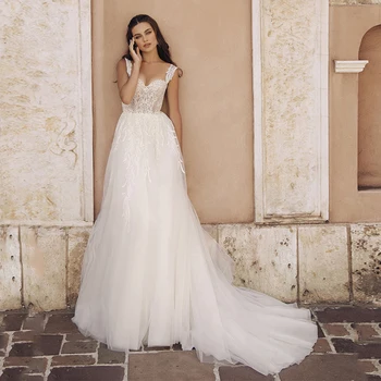 Charming Tulle A-line Wedding Gowns Sexy Sweetheart Appliques Court Train Sleeveless Bridal Dress Custom Made 
Charming Tulle A-line Wedding Gowns Sexy Sweetheart Appliques Court Train Sleeveless Bridal Dress Custom Made