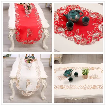 The new red embroidered table runner. Openwork lace tablecloth. The oval coffee table is covered with cloth. Beige table cloth
The new red embroidered table runner. Openwork lace tablecloth. The oval coffee table is covered with cloth. Beige table cloth