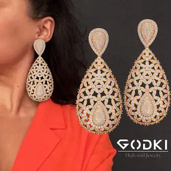GODKI Trendy Hollow Flowers African Dangle Earring For Women Wedding Cubic Zirconia DUBAI Bridal Earring Party Jewelry 2020 
GODKI Trendy Hollow Flowers African Dangle Earring For Women Wedding Cubic Zirconia DUBAI Bridal Earring Party Jewelry 2020