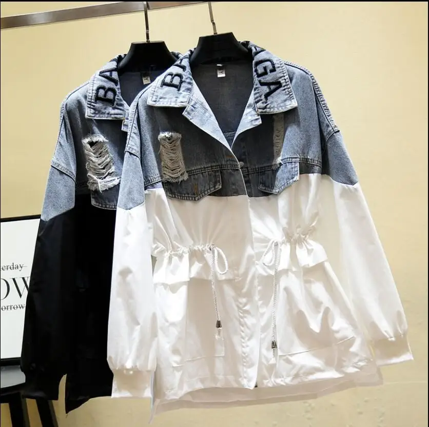 A new 2019 collection of ripped denim outerwear features a loose trench coat with tapered letters and embroidery for women in la
A new 2019 collection of ripped denim outerwear features a loose trench coat with tapered letters and embroidery for women in la