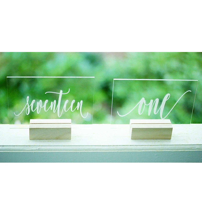 Personalized Calligraphy Acrylic Table Number Wedding Table Numbers with Holders Wedding Signage Clear Wood Table Number Stand
Personalized Calligraphy Acrylic Table Number Wedding Table Numbers with Holders Wedding Signage Clear Wood Table Number Stand