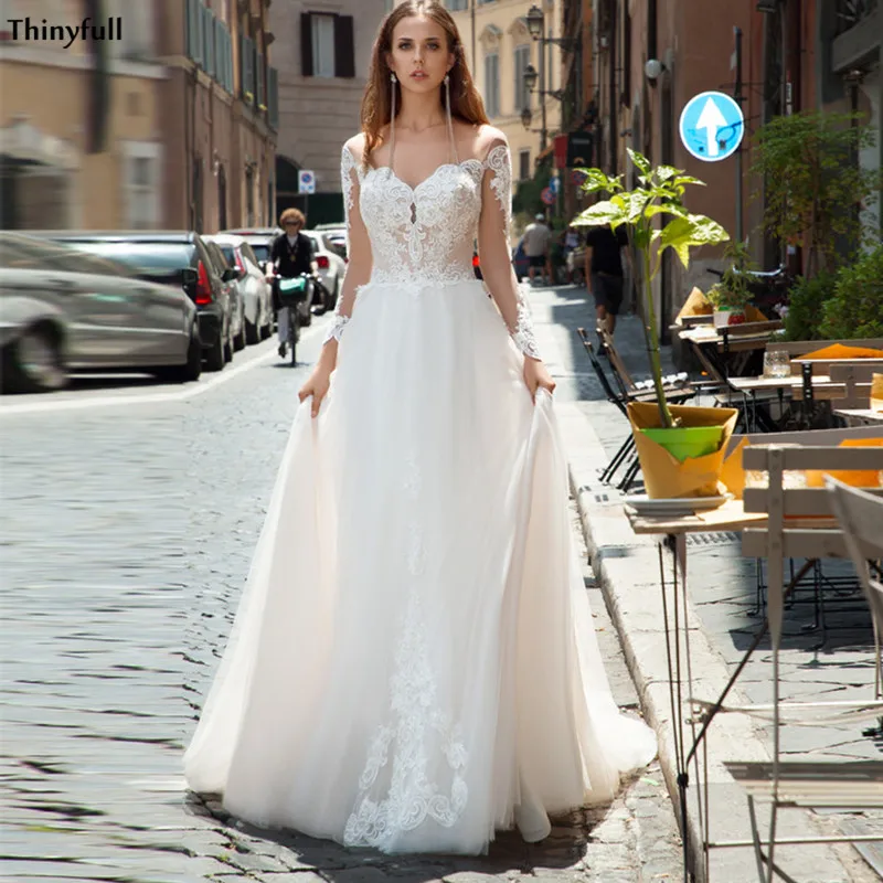 Thinyfull Long Sleeves Wedding Dresses Lace Appliques Illusion A Line Bride Dress Customized Bohemian Country Bridal Gowns
Thinyfull Long Sleeves Wedding Dresses Lace Appliques Illusion A Line Bride Dress Customized Bohemian Country Bridal Gowns