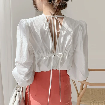 ZCSMLL 2020 summer Korean Chic Temperament Round Neck Loose Leak Back Tie Bow Tie Loose Solid Color Bubble Sleeve Shirt Female
ZCSMLL 2020 summer Korean Chic Temperament Round Neck Loose Leak Back Tie Bow Tie Loose Solid Color Bubble Sleeve Shirt Female