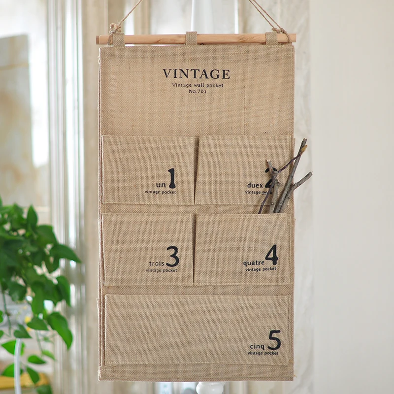 Hanging Type Storage Bag On Wall Foldable Canvas 5 Cells Door Pouch Bathroom Bedroom Sundry Holder Hang Organizer Jute Fiber Bag
Hanging Type Storage Bag On Wall Foldable Canvas 5 Cells Door Pouch Bathroom Bedroom Sundry Holder Hang Organizer Jute Fiber Bag