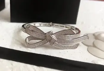 925 Sterling silver Fashion Crystal Bowknot Bangle classic Bow Tie Cuff Opening Bracelet wedding jewelry Silver Knot Bangle
925 Sterling silver Fashion Crystal Bowknot Bangle classic Bow Tie Cuff Opening Bracelet wedding jewelry Silver Knot Bangle