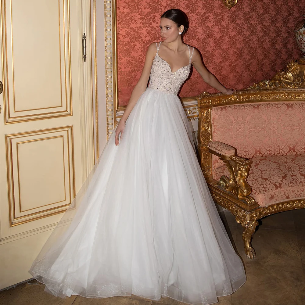 Romantic Tulle Wedding Gown Sexy Sweetheart Spagehetti Straps Sweep Train A Line Wedding Dresses with Beading
Romantic Tulle Wedding Gown Sexy Sweetheart Spagehetti Straps Sweep Train A Line Wedding Dresses with Beading