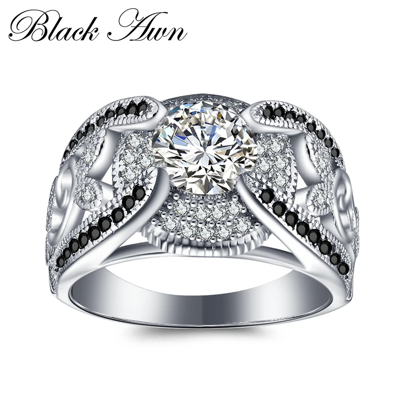 

Женское кольцо с черно-белым камнем, серебро 5,4 грамм