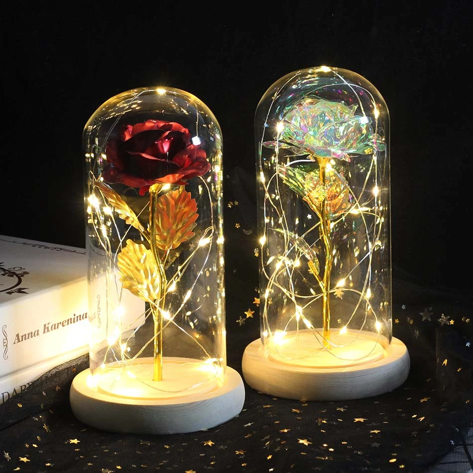 Artificial gold foil rose flowers and LED string lights on a glass dome on a wooden base Valentine's Day wedding home decoration
Artificial gold foil rose flowers and LED string lights on a glass dome on a wooden base Valentine's Day wedding home decoration