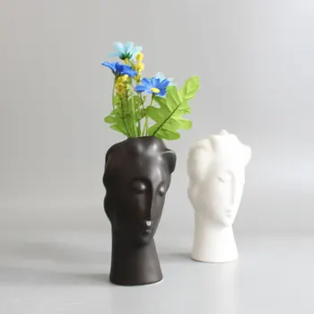 Nordic ins minimalist ceramic mini abstract vase black and white face creative display decoration statue head type vase
Nordic ins minimalist ceramic mini abstract vase black and white face creative display decoration statue head type vase