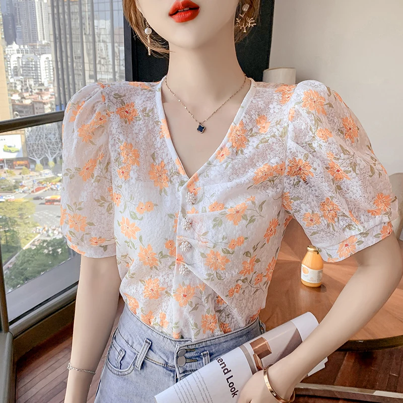 Woman Blouse Summer New 2021 V-neck Puff Sleeve Thin Print Floral Chiffon Shirt Top Pearl Flower Buttons Cardigan Short Blouses
Woman Blouse Summer New 2021 V-neck Puff Sleeve Thin Print Floral Chiffon Shirt Top Pearl Flower Buttons Cardigan Short Blouses