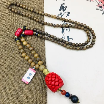 Zheru natural cinnabar carved red pine cone pendant with wooden bead necklace beautiful men and women sweater chain 
Zheru natural cinnabar carved red pine cone pendant with wooden bead necklace beautiful men and women sweater chain