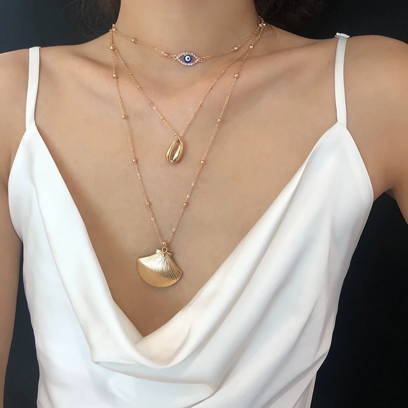 MultiLayers Blue Turkish Crystal Evil Eye Long Pendant Necklaces Simple Gold Color Alloy Conch Seashell Choker Necklace Bohemian
MultiLayers Blue Turkish Crystal Evil Eye Long Pendant Necklaces Simple Gold Color Alloy Conch Seashell Choker Necklace Bohemian