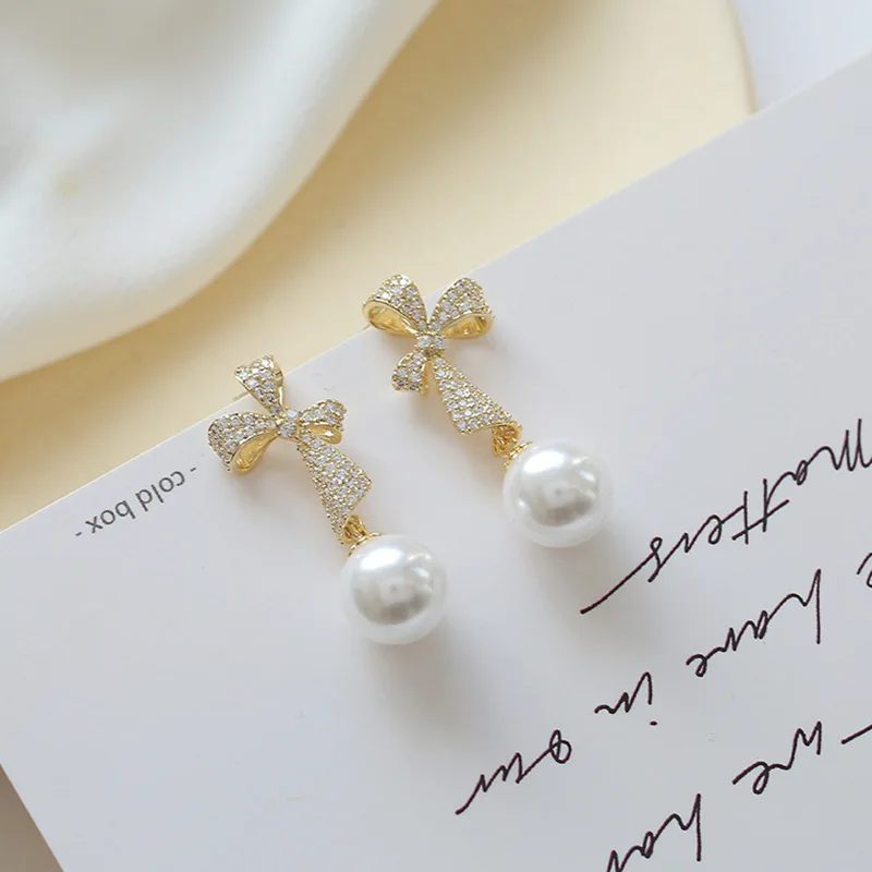 Korean Pure Silver Needle Bow Pearl Advanced Sense Small Group Elegant Long Earrings Temperament Earrings Female Stud Earrings
Korean Pure Silver Needle Bow Pearl Advanced Sense Small Group Elegant Long Earrings Temperament Earrings Female Stud Earrings