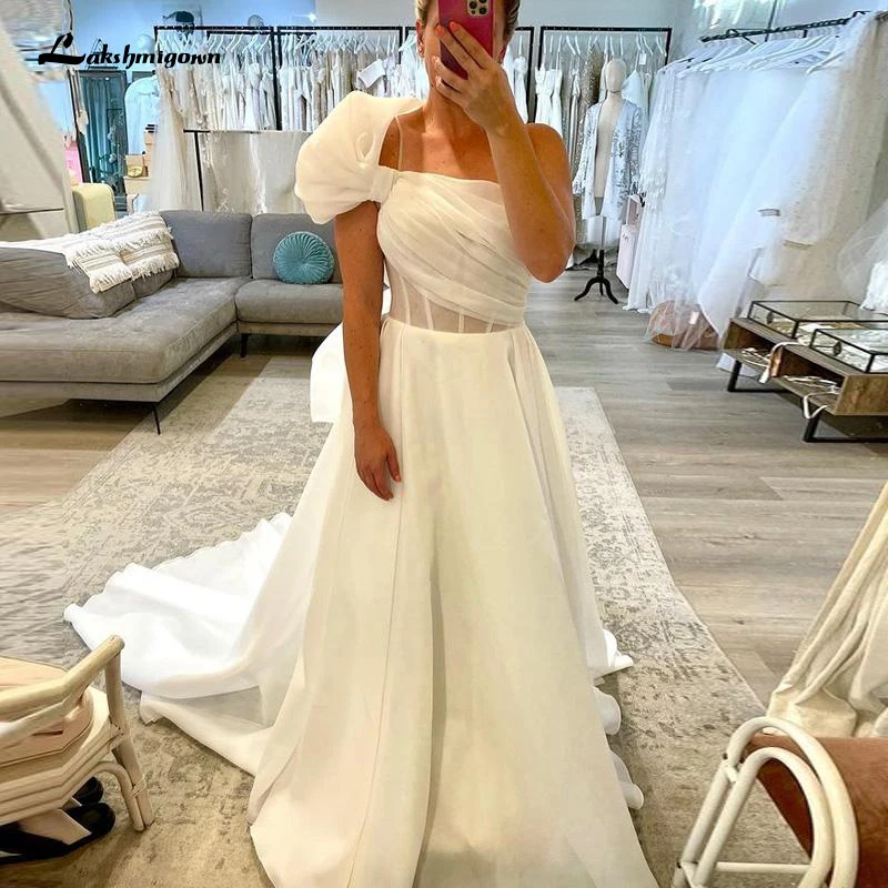 Unique One Shoulder A Line Wedding Dresses Ruched Organza Beach Bridal Gown Big Bow Tie Bohemian Robe De Mariee
Unique One Shoulder A Line Wedding Dresses Ruched Organza Beach Bridal Gown Big Bow Tie Bohemian Robe De Mariee