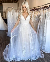 Wedding Dress A-Line V-Neck Cap Sleeve Lace Appliques Sequined Backless Tulle Floor Length Sweep Train Elegant Bride Gown 2021 
Wedding Dress A-Line V-Neck Cap Sleeve Lace Appliques Sequined Backless Tulle Floor Length Sweep Train Elegant Bride Gown 2021