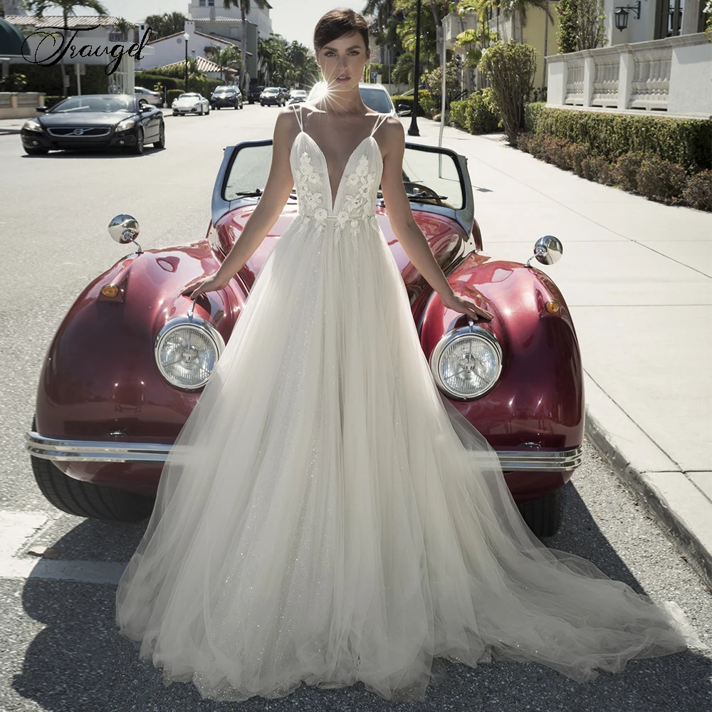 Traugel V-Neck A Line Wedding Dresses Glitter Applique Spaghetti Straps Backless Bride Dress Sweep Train Bridal Gowns Plus Size
Traugel V-Neck A Line Wedding Dresses Glitter Applique Spaghetti Straps Backless Bride Dress Sweep Train Bridal Gowns Plus Size