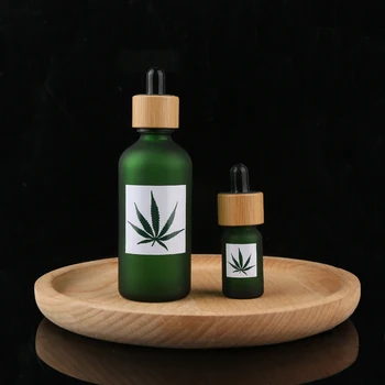 

Skincare bamboo 15ml 30ml 50ml 100ml Green frosted Glass CBD Oil Dropper Bottle with Bamboo pipette Cap Cosmetic Serum Bottle