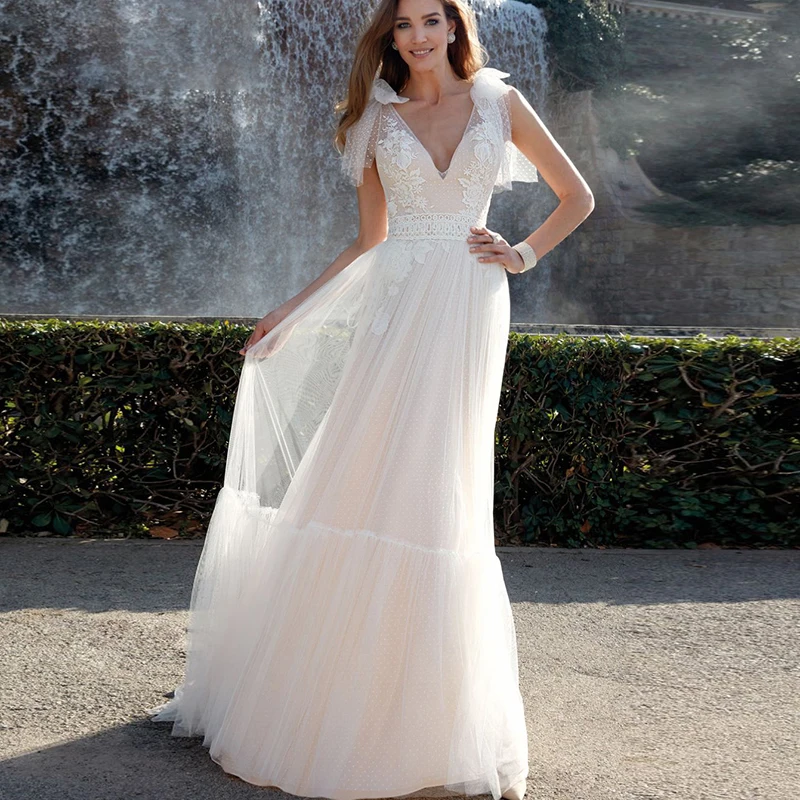 Летние пляжные свадебные платья в стиле бохо, Кружевной Тюль в горошек, трапециевидная юбка с V-образным вырезом и бантом, свадебное платье
Летние пляжные свадебные платья в стиле бохо, Кружевной Тюль в горошек, трапециевидная юбка с V-образным вырезом и бантом, свадебное платье