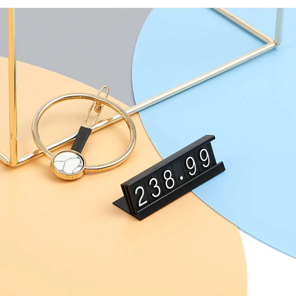 Aluminum Frame Jewelry Numeral Pricing Cube Sign Adjustable Number Price Tag Display Counter Stand Tag Label Set for Retail Shop
Aluminum Frame Jewelry Numeral Pricing Cube Sign Adjustable Number Price Tag Display Counter Stand Tag Label Set for Retail Shop