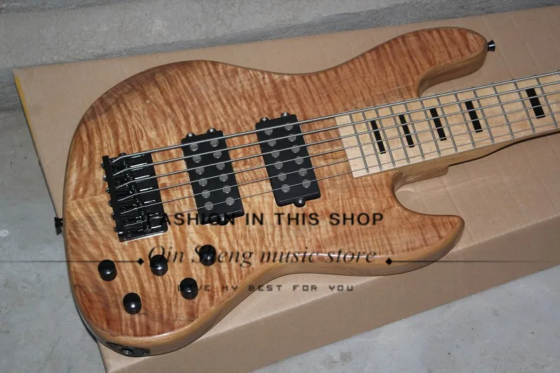 free shipping custom 6 strings electric bass guitar with flamed veneer body,maple fretboard with black inlay,black hardware
free shipping custom 6 strings electric bass guitar with flamed veneer body,maple fretboard with black inlay,black hardware