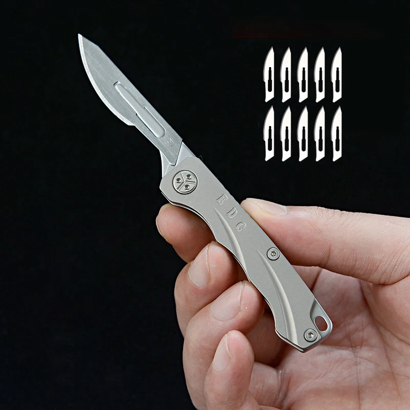Titanium Alloy Folding Scalpel Knife Utility Knife Portable Demolition Express Key Chain Open Box Knife
Titanium Alloy Folding Scalpel Knife Utility Knife Portable Demolition Express Key Chain Open Box Knife