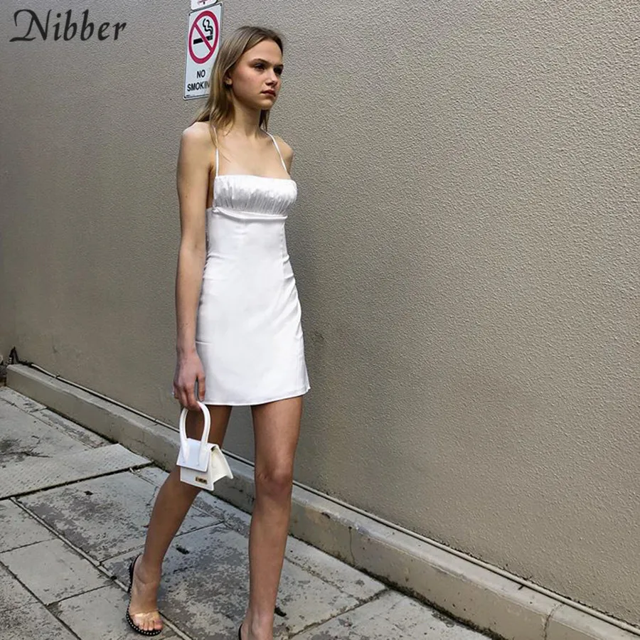 Nibber sexy hollow backless black white sleeveless mini dresses women 2020spring Slim Silk home wear leisure bodycon dress femme
Nibber sexy hollow backless black white sleeveless mini dresses women 2020spring Slim Silk home wear leisure bodycon dress femme