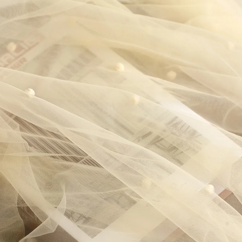 Фото Марлевая ткань абрикосовая мягкая пряжа кружевная ручной работы фон свадебного
