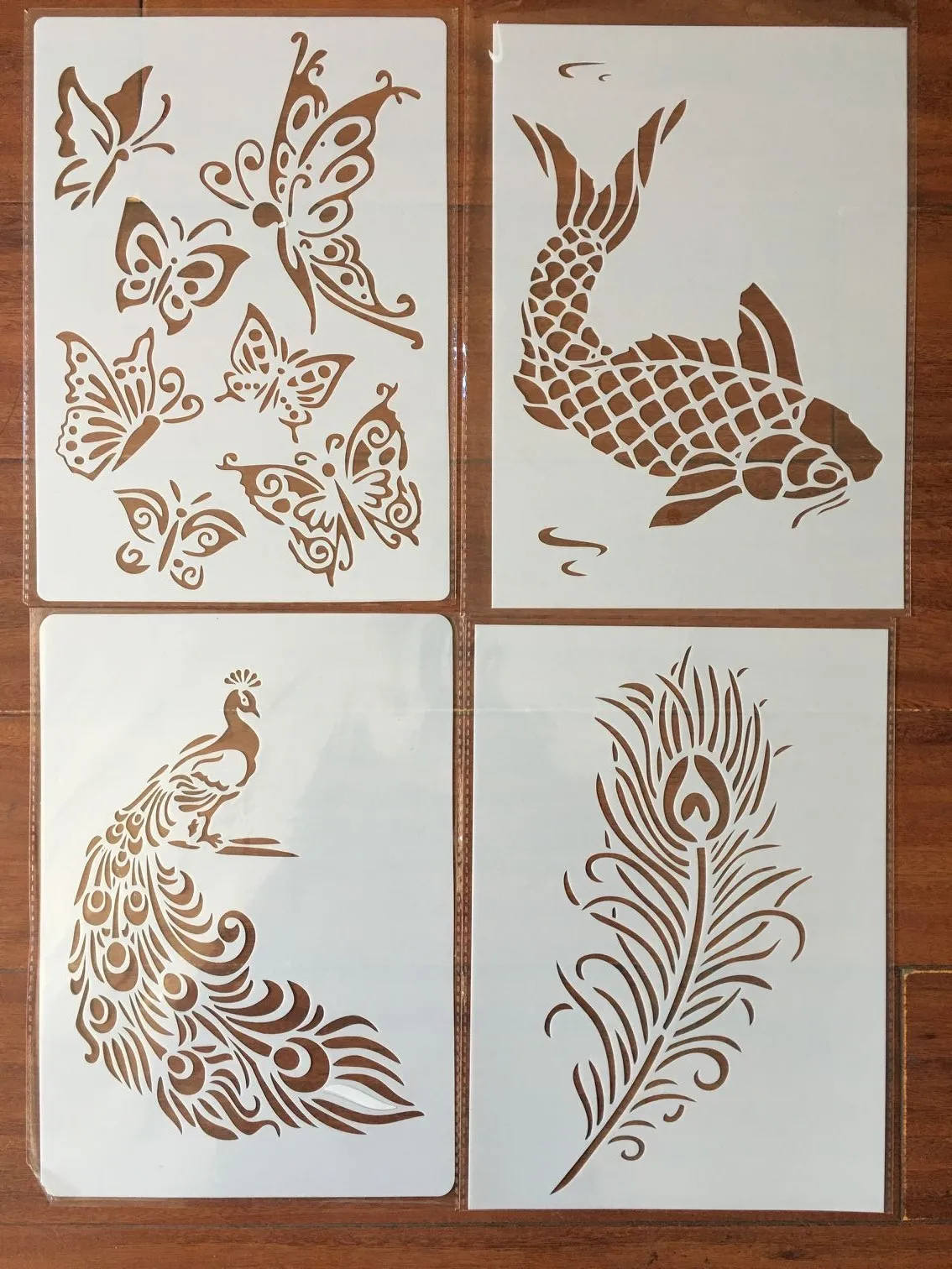 4pcs / set A4 Peacock feather fish butterfly Stencils Painting Coloring Embossing Scrapbook Album Decorative Template
4pcs / set A4 Peacock feather fish butterfly Stencils Painting Coloring Embossing Scrapbook Album Decorative Template