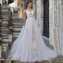 Gorgeous Wedding Dress 2021 A-Line Sheer Neck Cap Sleeve Lace Appliques Button Sweep Train Tulle Bridal Gown Vestidos De Noiva
Gorgeous Wedding Dress 2021 A-Line Sheer Neck Cap Sleeve Lace Appliques Button Sweep Train Tulle Bridal Gown Vestidos De Noiva