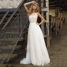 Bohemian Wedding Dress A-Line O-Neck Tank Lace Appliques Sequined Backless Pearls Sashes Floor Length Sweep Train Bride Gown New 
Bohemian Wedding Dress A-Line O-Neck Tank Lace Appliques Sequined Backless Pearls Sashes Floor Length Sweep Train Bride Gown New