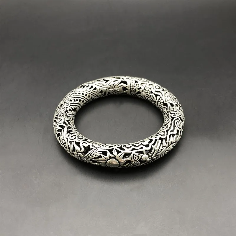 Hollowed out Dragon Phoenix bracelet jewelry national style pure handmade Miao silver hollow thick round Bracelet
Hollowed out Dragon Phoenix bracelet jewelry national style pure handmade Miao silver hollow thick round Bracelet