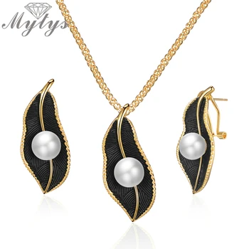 

Mytys Pearls On Black Leaf Jewelry Sets For Women Retro Romantic Gold Wire Frames Leaf Pendant Necklace Earrings Sets CE611CN540