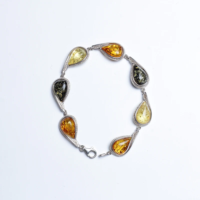 Natural chicken oil yellow beeswax amber bracelet with flowers Perdoch with a single ring silver bracelet female models
Natural chicken oil yellow beeswax amber bracelet with flowers Perdoch with a single ring silver bracelet female models