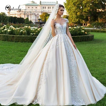 Optcely Gorgeous Champagne O-neck Cap Sleeve Royal Wedding Dresses Button Luxury Lace Appliques Beaded Princess Sweep Train Gown
Optcely Gorgeous Champagne O-neck Cap Sleeve Royal Wedding Dresses Button Luxury Lace Appliques Beaded Princess Sweep Train Gown