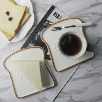 Home Creative Bread Shaped Flat Plate Breakfast Snack Plate Ceramic Afternoon Simple Modern Tea Bread Toast Sushi Plate LB41109
Home Creative Bread Shaped Flat Plate Breakfast Snack Plate Ceramic Afternoon Simple Modern Tea Bread Toast Sushi Plate LB41109
