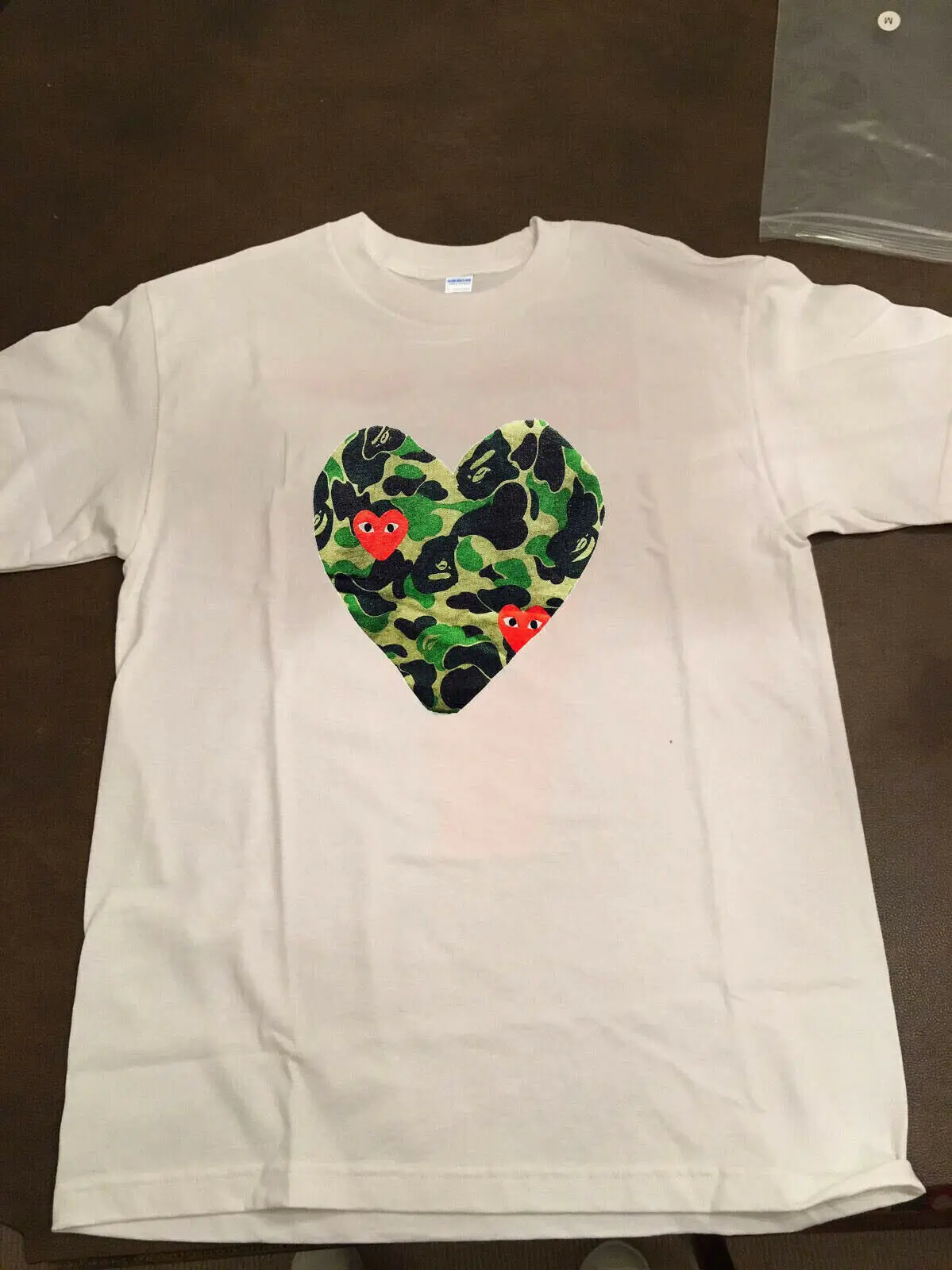 VTG Rare nercdg comme des carcons x ba pe Full Heart glidan Reprint Long Sleeve Hoddies unisex hoddie short sleeve Tee Shirt Fre
VTG Rare nercdg comme des carcons x ba pe Full Heart glidan Reprint Long Sleeve Hoddies unisex hoddie short sleeve Tee Shirt Fre