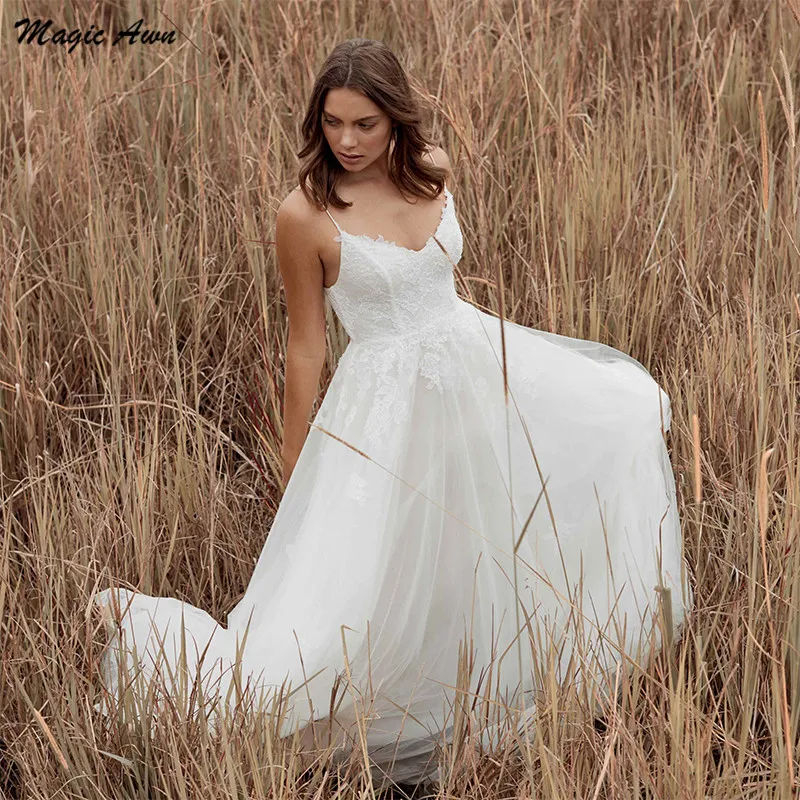 Magic Awn Bohemian Lace Tulle Wedding Dresses Beack Appliques Spaghetti Straps Backless Bridal Gowns A-Line Cheap Robe De Mariee
Magic Awn Bohemian Lace Tulle Wedding Dresses Beack Appliques Spaghetti Straps Backless Bridal Gowns A-Line Cheap Robe De Mariee
