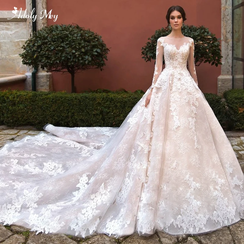 Adoly Mey Elegant O-Neck Long Sleeve Lace A-Line Wedding Dresses 2020 Luxury Beaded Appliques Royal Train Princess Bridal Gown 
Adoly Mey Elegant O-Neck Long Sleeve Lace A-Line Wedding Dresses 2020 Luxury Beaded Appliques Royal Train Princess Bridal Gown
