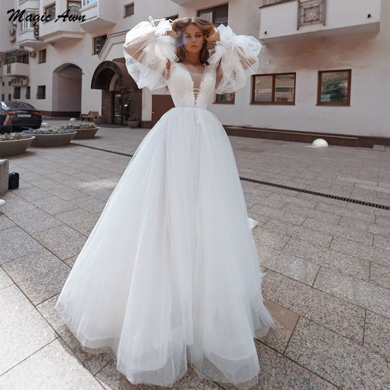Magic Awn Long Puff Sleeves Boho Wedding Dresses Lace Appliques Illusion Princess Beach A-Line Mariage Gowns Lace Up Back 2021
Magic Awn Long Puff Sleeves Boho Wedding Dresses Lace Appliques Illusion Princess Beach A-Line Mariage Gowns Lace Up Back 2021