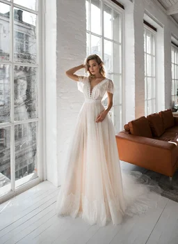 Licht Champagne Boho Trouwjurken Lace Tulle Flare Mouwen Bruid Jurken V-hals Open Back Bohemian Wedding Bruidsjurken
Licht Champagne Boho Trouwjurken Lace Tulle Flare Mouwen Bruid Jurken V-hals Open Back Bohemian Wedding Bruidsjurken