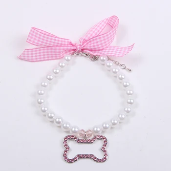 Dog Pet Pearls Necklace Collar with Rhinestones Bone Charm Pet Puppy Jewelry Accessory for Dogs Puppies Small Medium 
Dog Pet Pearls Necklace Collar with Rhinestones Bone Charm Pet Puppy Jewelry Accessory for Dogs Puppies Small Medium