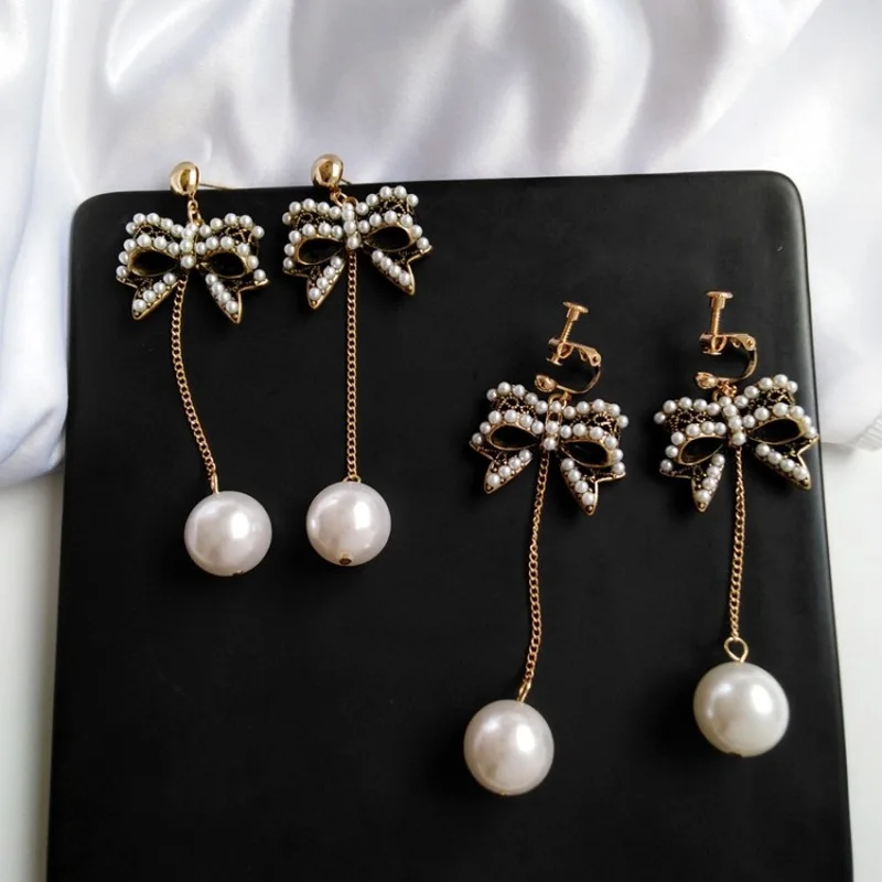 Korean Vintage Temperament Imitation Pearl Long Tassel Earrings Personality Fashion Bow Jewelry Women Girl Ear Clip Accessories
Korean Vintage Temperament Imitation Pearl Long Tassel Earrings Personality Fashion Bow Jewelry Women Girl Ear Clip Accessories